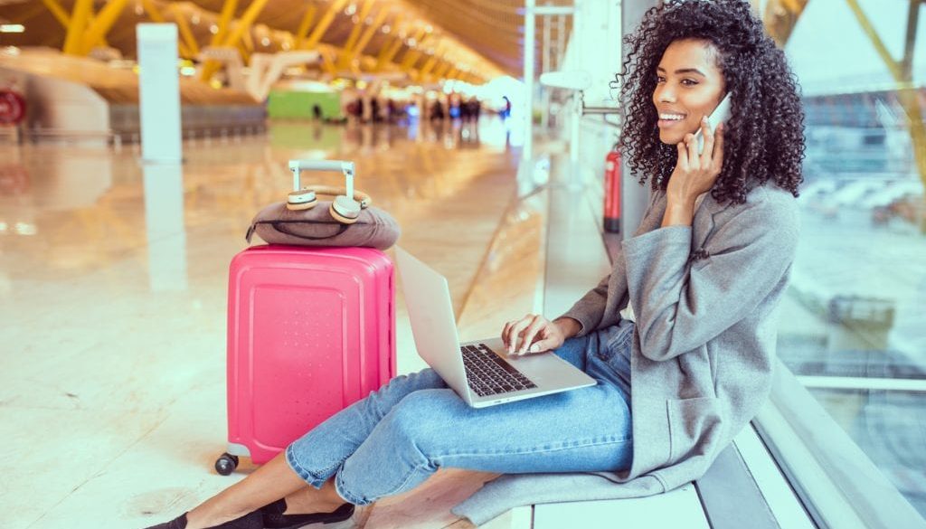 girl in airport talking on cellphone